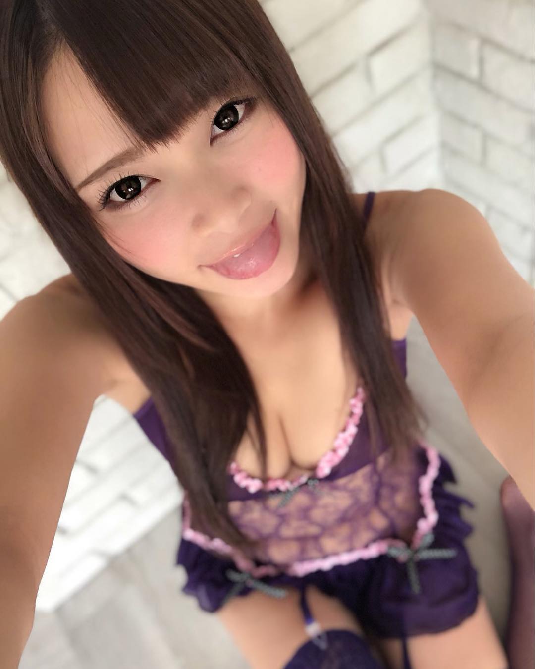 Cute Japanese girl Natsumi Airi in a plum colored lingerie nightgown